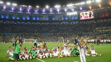 Les joueurs allemands célèbrent leur victoire finale au Mondial-2014, le 13 juillet 2014 à Rio de Janeiro [PATRIK STOLLARZ / AFP/Archives]