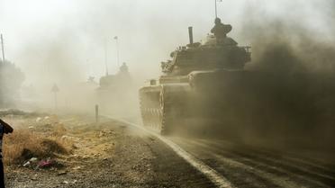 Des chars de l'armée turque font route vers la ville syrienne de Jarablos le 25 août 2016 [BULENT KILIC / AFP/Archives]