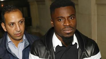 Le défenseur ivoirien du PSG Serge Aurier à son arrivée le 26 septembre 2016 au Palais de justice de Paris [PATRICK KOVARIK / AFP]
