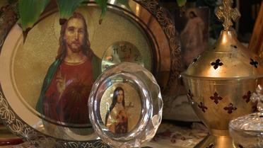 Des icônes religieuses dans le salon d'une famille chaldéenne à Sarcelles le 3 août 2014 [ / AFP/Archives]