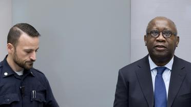 L'ancien président de Côte d'Ivoire, Laurent Gbagbo (d), à l'ouverture de son procès à la CPI, le 28 janvier 2016 à La Haye [Peter Dejong / POOL/AFP/Archives]