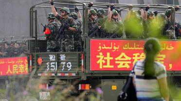 Le 6 juin 2014, des forces de sécurité participent à une manoeuvre militaire à Hetian, dans la région du nord ouest de la Chine de Xinjiang  [AFP / AFP/Archives]