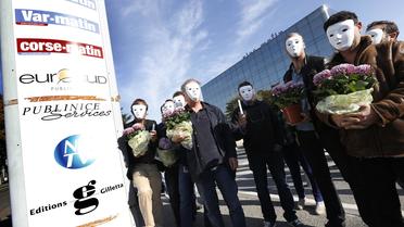 Des salariés de Nice-Matin protestent contre un plan de restructuration du groupe, à Nice le 1er novembre 2013 [Valery Hache / AFP/Archives]