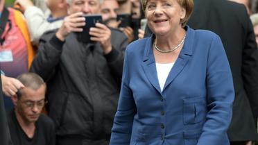La chancelière allemande Angela Merkel arrive à Duisburg en Allemagne pour participer à un "dialogue avec des citoyens", le 25 août 2015 [Federico Gambarini / DPA/AFP]