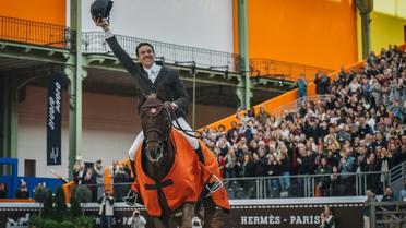 Le Français Simon Delestre sur son cheval Hermès Ryan enlève la 10e édition du Saut Hermès au Grand Palais le 24 mars 2019 [Lucas BARIOULET / AFP]