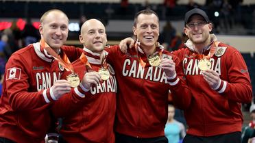 L'équipe canadienne de curling qualifiée pour les JO de Sotchi, Brad Jacobs, Ryan Fry, E.J. Harnden et Ryan Harnden (de g à d), le 8 décembre 2013 à Winnipeg (Canada) [Trevor Hagan / Getty Images/AFP/Archives]