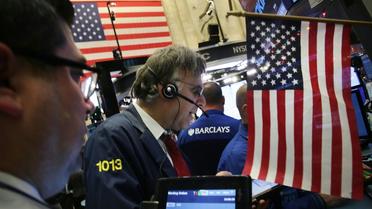 Des traders à la Bourse de New York , le 8 décembre 2015. [Spencer PLATT / GETTY IMAGES NORTH AMERICA/AFP/Archives]