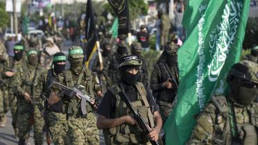 Des membres des brigades Ezzedine al-Qassam, la branche armée du Hamas, lors d'un défilé militaire contre Israël, le 25 juillet 2017 à Gaza [MAHMUD HAMS / AFP]