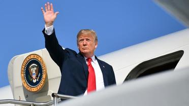 Le président Donald Trump embarque dans son Air Force One à Morristown dans le New Jersey, le 4 août 2018 [MANDEL NGAN / AFP]
