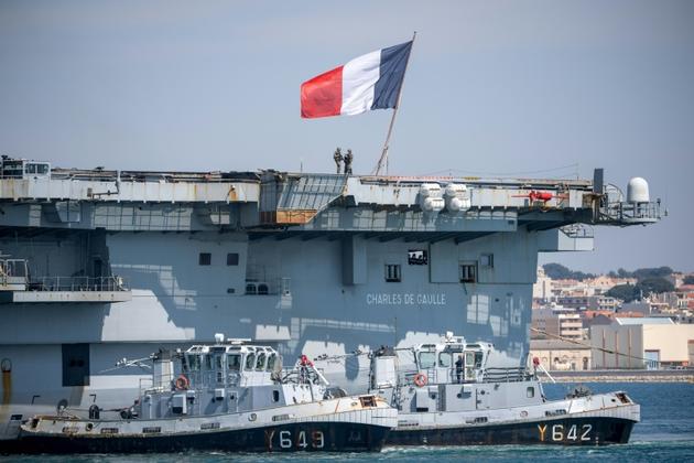 Le porte-avions Charles-de-Gaulle accoste à Toulon le 12 avril 2020 [Christophe SIMON / AFP]