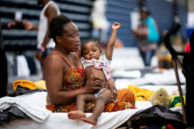 Teresa Okoma Wayemala avec Melissa, sa fille de deux ans [Johannes EISELE / AFP]