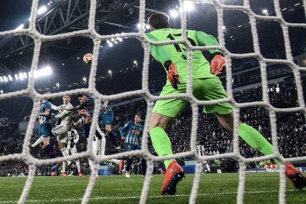 L'attaquant de la Juventus Cristiano Ronaldo (2g) auteur d'un triplé lors de la victoire 3-0 sur l'Atlético Madrid en Ligue des champions le 12 mars 2019 [Marco BERTORELLO                   / AFP]