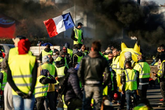 Des "gilets jauens" rassemblées le 18 novembre à Caen lors du deuxième jour de mobilisation de ce mouvement protestant contre la hausse des carburants- [CHARLY TRIBALLEAU / AFP/Archives]