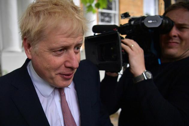Le député conservateur Boris Johnson (g), le 7 juin 2019 à Londres [Daniel LEAL-OLIVAS / AFP]