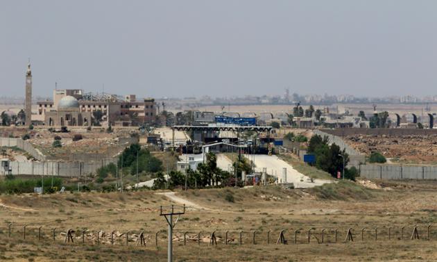 Vue générale depuis la Jordanie du poste-frontière de Jaber, connu sous le nom de Nassib en Syrie, le 7 juillet 2018 [Khalil MAZRAAWI / afp/AFP]