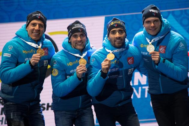 Martin Fourcade et ses équipiers du relais masculin posent avec leur médaille d'or après leur victoire aux Mondiaux d'Anterselva en Italie le  22 février 2020 [MARCO BERTORELLO / AFP/Archives]