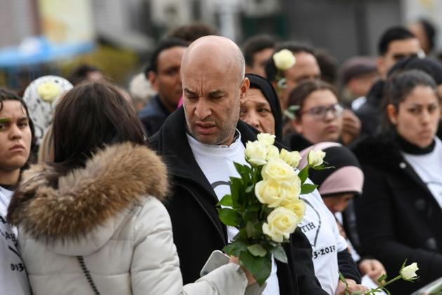 Le père d'Adam lors de la marche en hommage à Adam Soli and Fatih Karakuss, à Grenoble le 6 mars 2019 [JEAN-PIERRE CLATOT / AFP]