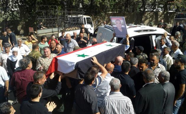 Photo diffusée le 26 juillet 2018 par l'agence de presse syrienne Sana montrant les funérailles de l'une des victimes des attaques commises le 25 juillet 2018 par l'EI dans la ville de Soueida, dans le sud de la Syrie [STR / SANA/AFP]