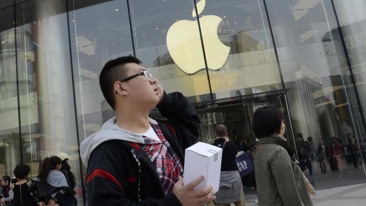 Devant une boutique Apple à Pékin [Wang Zhao / AFP/Archives]