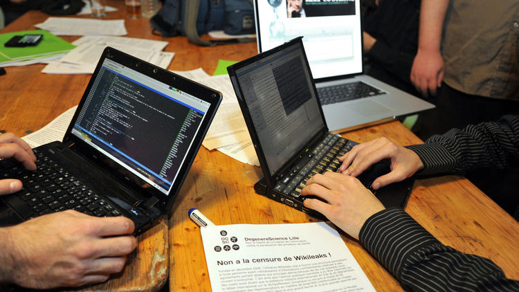 Des hackers [Philippe Huguen / AFP/Archives]