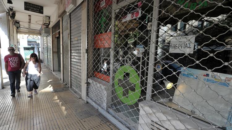 Pharmacie fermée lors d'une grève générale contre un nouveau plan de rigueur, le 26 septembre 2012 à Athènes [Louisa Gouliamaki / AFP]