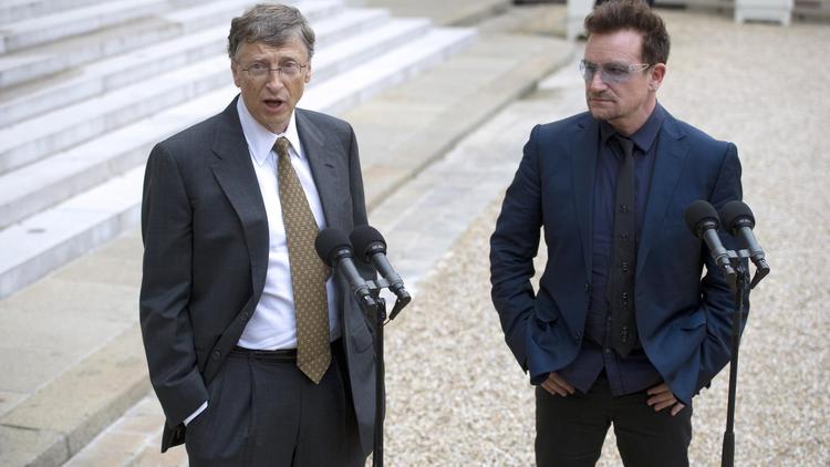 Bono et BIll Gates, le 10 octobre 2012 au Palais de l'Elysée à PAris [Lionel Bonaventure / AFP]