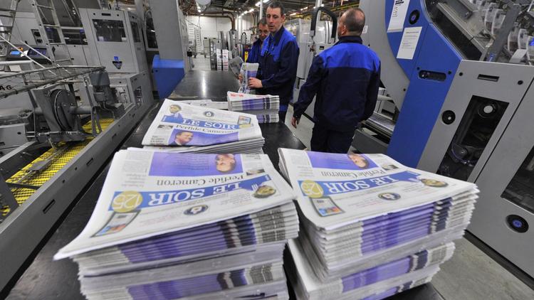 Des exemplaires du quotidien Le Soir dans une imprimerie de Bruxelles, le 24 janvier 2013 [Georges Gobet / AFP/Archives]