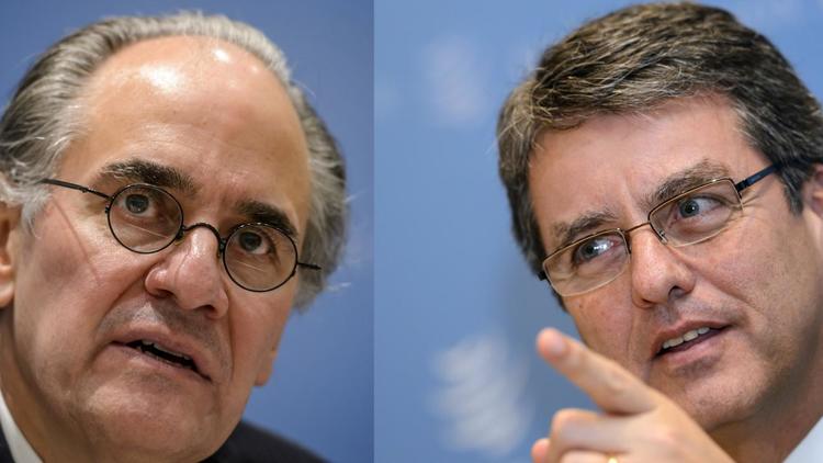 Photo montage des deux finalistes pour le poste de directeur général de l'OMC, Herminio Blanco (g) et Roberto Azevedo [Fabrice Coffrini / AFP/Archives]