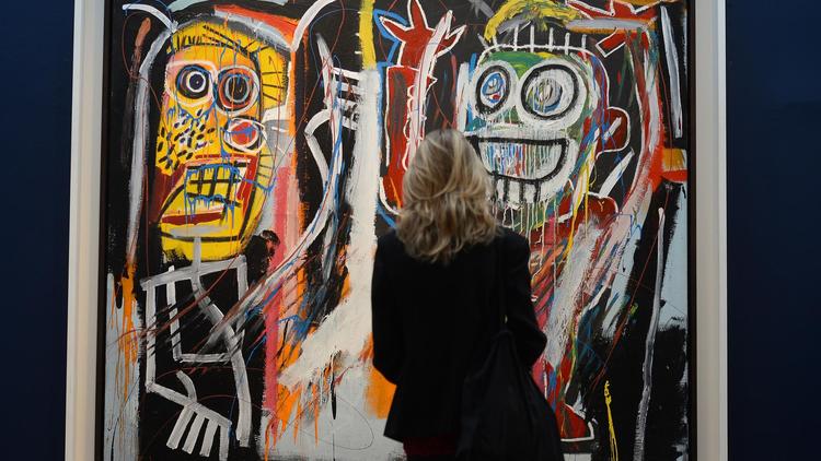 Le tableau "Dustheads", de Jean-Michel Basquiat, dans la salle des ventes de Christie's à New York, le 3 mai 2013 [Emmanuel Dunand / AFP/Archives]