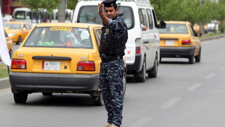 Un policier à Bagdad [Ahmad al-Rubaye / AFP/Archives]