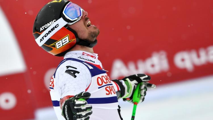 Marcel Hirscher exulte après son sacre mondial dans le slalom géant à Saint-Moritz, le 17 février 2017 [Fabrice COFFRINI / AFP]