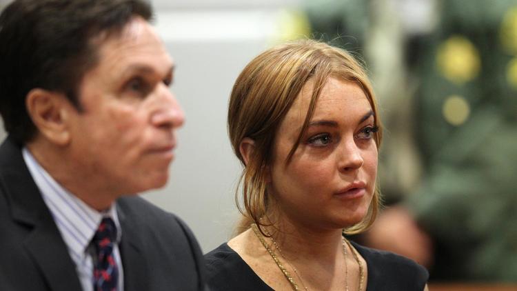 Lindsay Lohan et son avocat Mark Heller, au tribunal de Los Angeles le 30 janvier 2013 [David Mcnew / Getty Images/AFP/Archives]