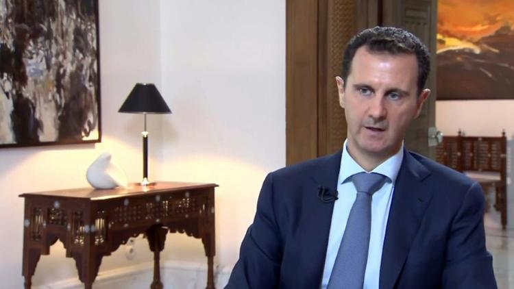 Une capture d'écran montre Bachar al-Assad le 4 octobre 2015 lors d'une interview télévisée [HO / IRIB/AFP]