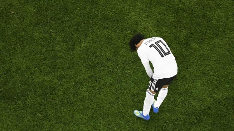 La déception de l'attaquant vedette égyptien Mohamed Salah après la défaite face à la Russie, le 19 juin 2018 à Saint-Pétersbourg [CHRISTOPHE SIMON / AFP]