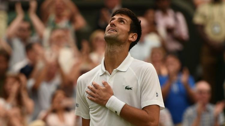 Le Serbe Novak Djokovic se qualifie pour la finale de Wimbledon en battant l'Espagnol Rafael Nadal, le 14 juillet 2018 [Oli SCARFF                           / AFP]