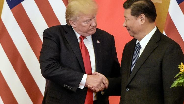 Le président américain Donald Trump et son homologue chinois Xi Jingping à Pékin le 9 novembre 2017 [Fred DUFOUR / AFP/Archives]