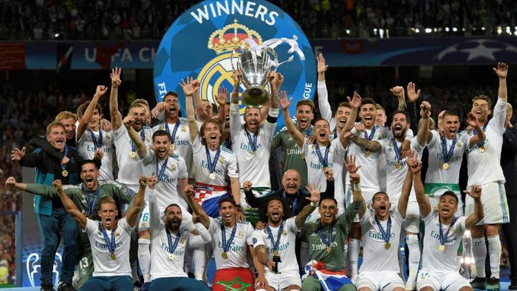 Les joueurs du Real Madrid avec le trophée de la Ligue des champions remportée le 26 mai 2018 à Kiev face à Liverpool [LLUIS GENE                           / AFP/Archives]