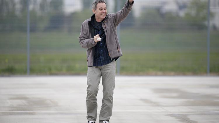 L'ex-otage en Syrie Didier Francois à son arrivée à l'aéroport de Villacoublay le 20 avril 2014 [Kenzo Tribouillard / AFP/Archives]