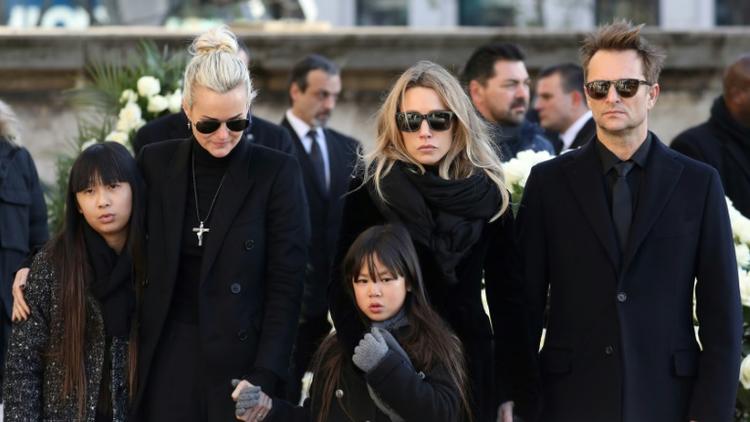Laeticia Hallyday, Laura Smet, David Hallyday, Jade et Joy lors de l'enterrement du rockeur à l'église de la Madeleine à Paris le 9 décembre 2017 [ludovic MARIN / POOL/AFP/Archives]