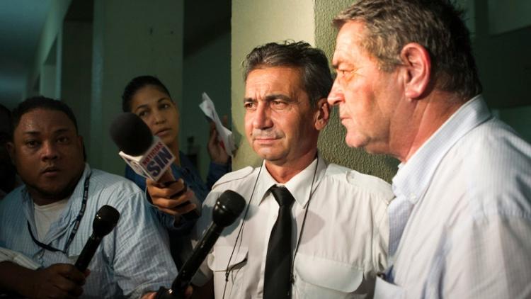 Les pilotes Bruno Odos et Pascal Fauret accusés d'avoir transporté de la cocaïne de la République dominicaine à la France, le 15 août 2015 à Saint-Domingue [ERIKA SANTELICES / AFP/Archives]