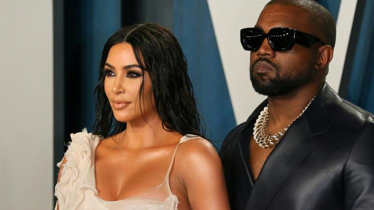 Kim Kardashian et Kanye West lors d'une fête à l'occasion des Oscars à Beverly Hills, le 9 février 2020 [Jean-Baptiste Lacroix / AFP/Archives]