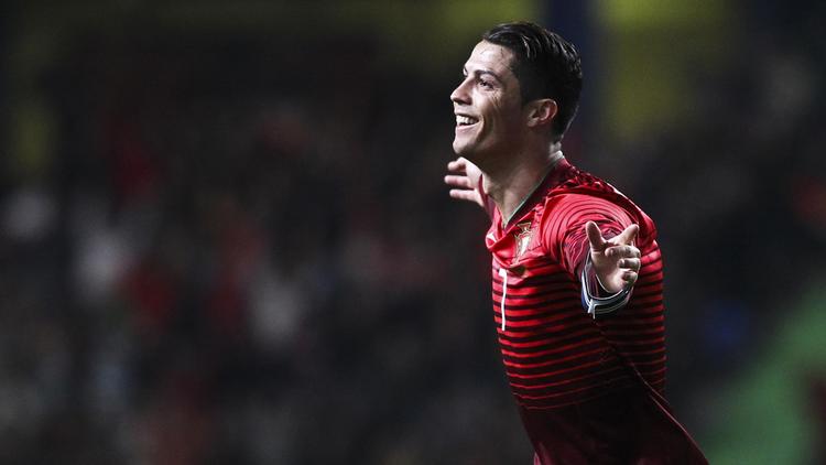L'attaquant du Portugal Cristiano Ronaldo exulte après un but contre le Cameroun lors d'un match amical, le 5 mars 2014 à Leiria [Pedro Nunes / AFP/Archives]