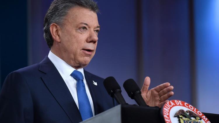 "La paix en Colombie est proche" a assuré le président Juan Manuel Santos lors d'une conférence de presse à Bogota, le 5 octobre 2016 [Cesar CARRION / Colombian Presidency/AFP]