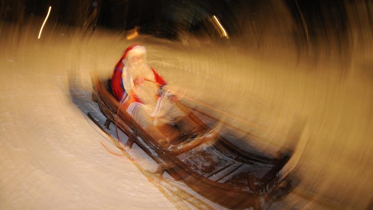 Un père Noël et ses rennes en Finlande [Olivier Morin / AFP/Archives]