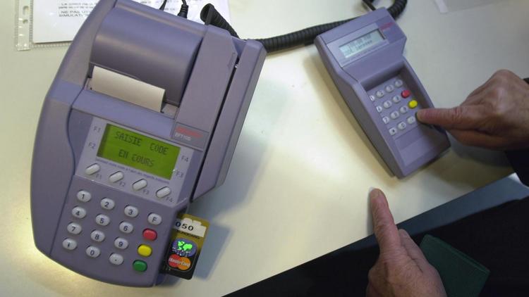 Un système de paiement par carte bancaire [Mychele Daniau / AFP/Archives]