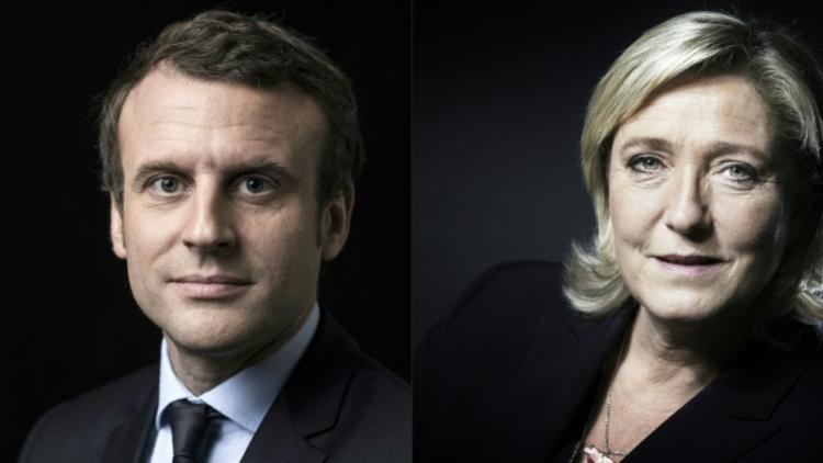Emmanuel Macron (g) battrait largement Marine Le Pen (d) au second tour de l'élection présidentielle, selon deux sondages réalisés dimanche soir après l'annonce des résultats du 1er tour [Eric FEFERBERG, JOEL SAGET / AFP/Archives]