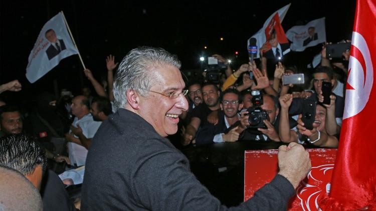 Le candidat à la présidentielle tunisienne Nabil Karoui est accueilli par ses partisans après sa libération de prison, près de Tunis, le 9 octobre 2019 [ANIS MILI / AFP]