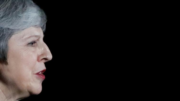 Theresa May doit convaincre le Parlement britannique qui votera en décembre pour ou contre le projet d'accord élaboré avec l'Union européenne mardi (photo prise lors de sa déclaration à la presse le 14 novembre 2018 à Londres) [Tolga AKMEN / AFP]