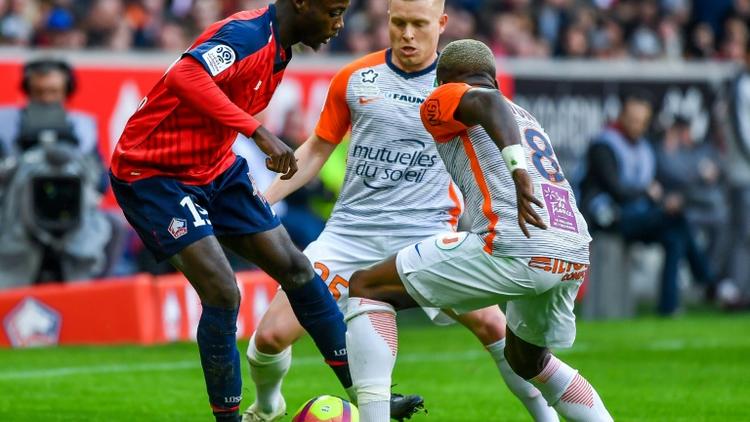 L'attaquant de Lille Nicolas Pépé (g) contre Montpellier, le 17 février 2019 au stade Pierre-Mauroy, à Villeneuve-d'Ascq [PHILIPPE HUGUEN / AFP]