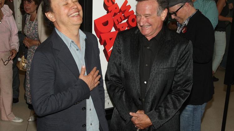 Les acteurs Billy Crystal (g) et Robin Williams, le 13 août 2009 à Los Angeles [Jason Merritt / Getty Images/AFP/Archives]